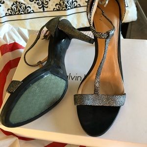 Calvin Klein metallic high heeled sandals.